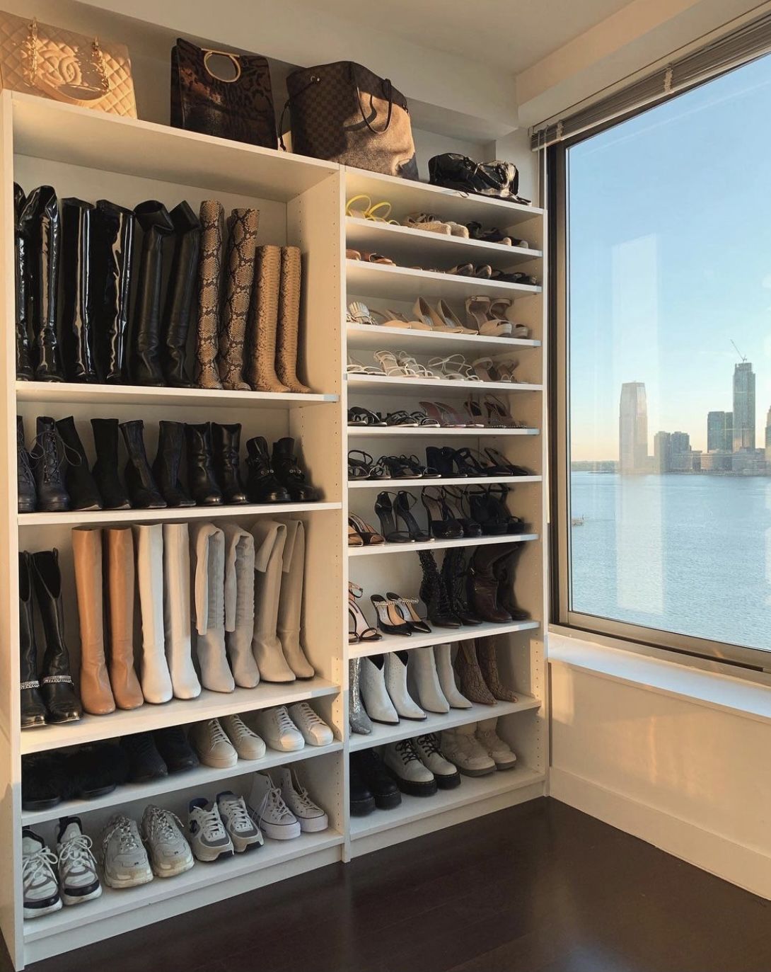 Custom shoe closet with New York skyline view by Swoon Spaces